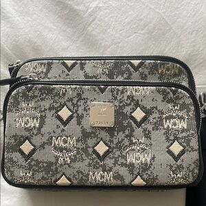 MCM Black and Cream Women's
New w/o tags. Dust bag and serial number incl